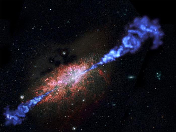 Een artist impression van een radiosterrenstelsel waarin zich snel sterren vormen. De radiostraling is in blauw; in het sterrenstelsel zijn veel felle nieuwe sterren te zien. Credit: ESA/NASA/RUG/MarcelZinger