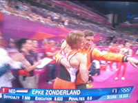 Zonderland and his coach embrace when they see the score