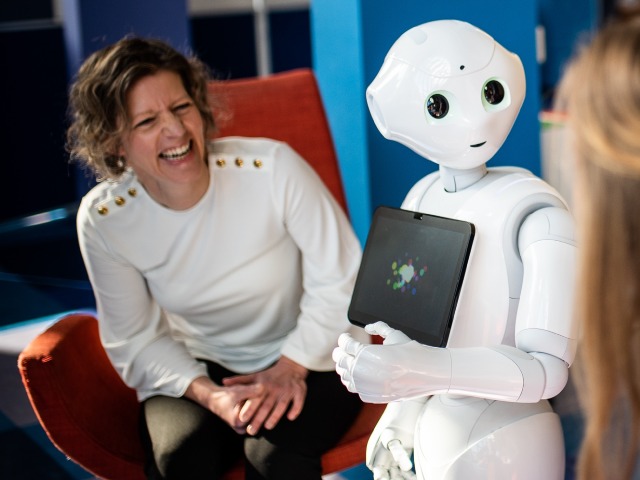 Professor of Services Marketing Jenny van Doorn and service robot Pepper