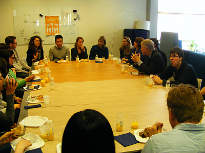 Francis Collins in discussion with young researchers
