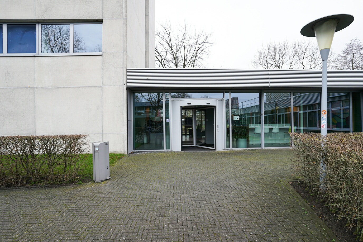 Entrance at the back of the building, automatic revolving door