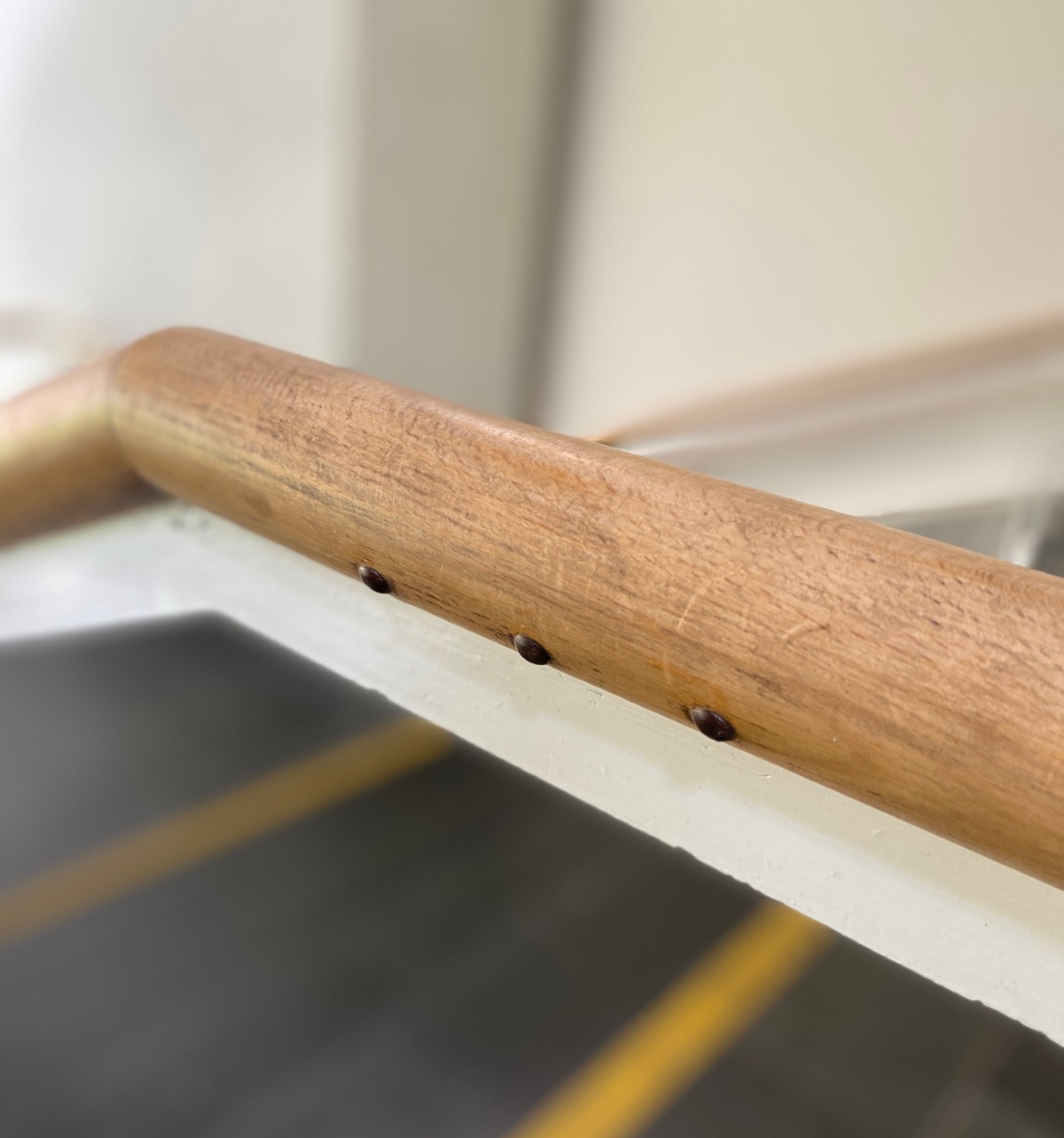 In the stairwell, there are a number of metal buttons at the bottom of the banister, corresponding to the floor in the building you are on.