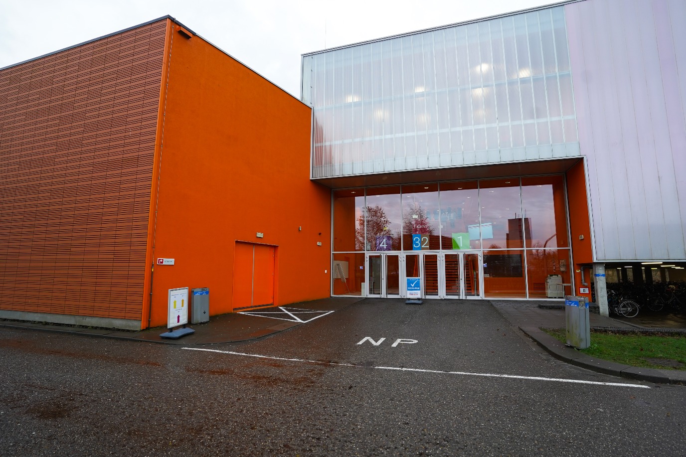 Exams entrance, from the bridge straight ahead and on the left