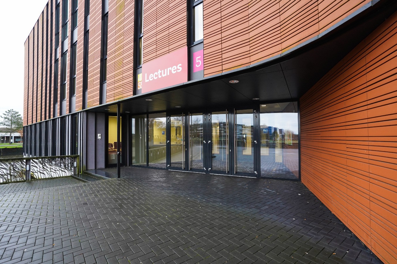 Lectures entrance, from the bridge immediately to the left