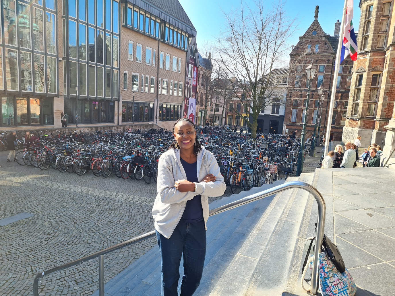 Dr. Ndugga in front of the Academy Building