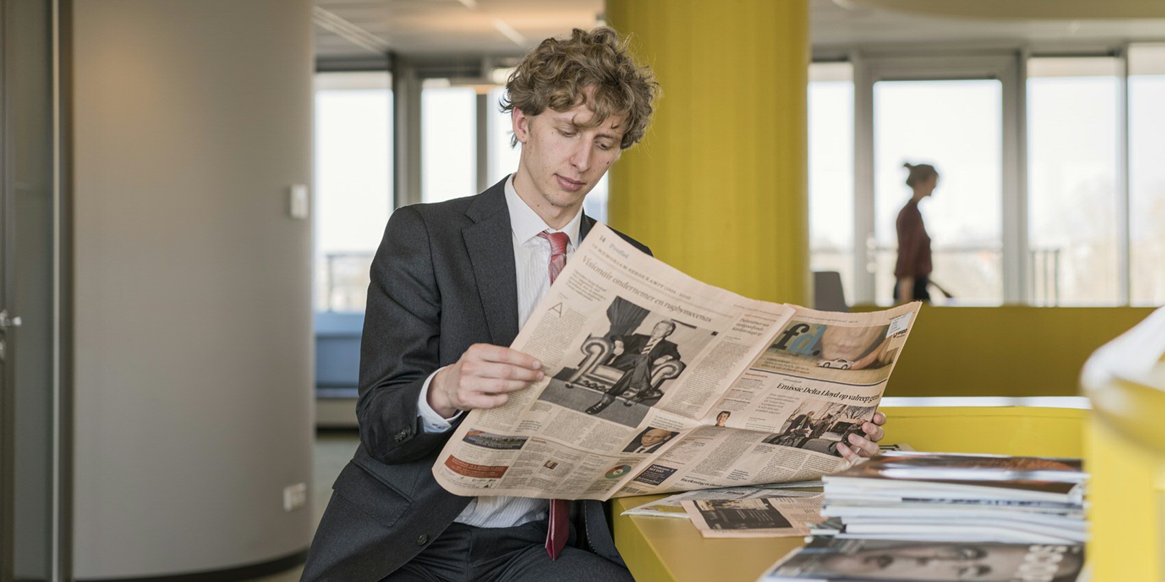 man reading paper