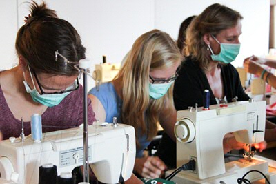 Mariska working in the pop-up sweatshop 'Both Sides'