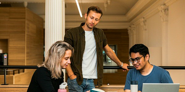 Students in the Beurs, the faculty building of Campus Fryslân