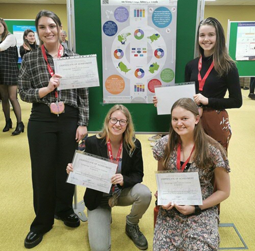 The winning team: Hufferd, Horinga, Cockx & Kallo with their poster ''Comparing cultural influence of slang usage amongst youth''