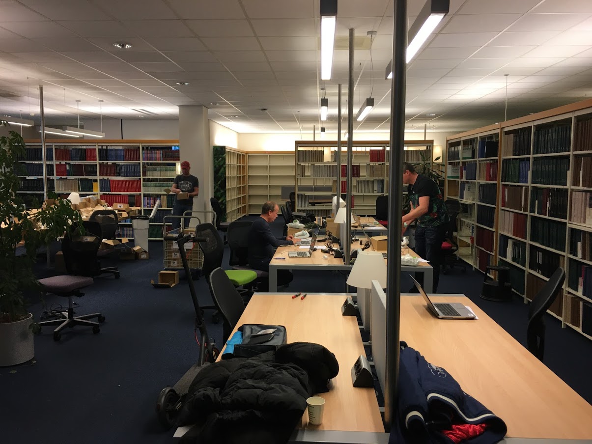 Laptops between the journal cabinets