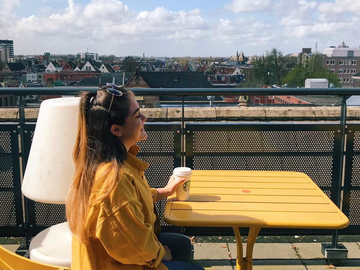 The most basic Insta Pic: Matching outfits with the UB terrace tables while holding a Starbucks coffee