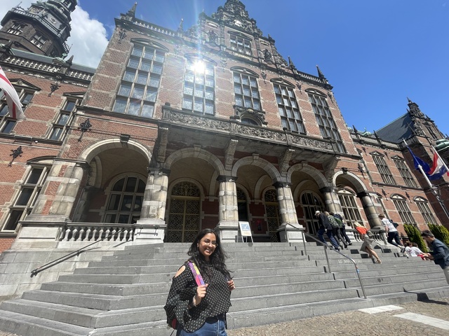 Student Khushboo in front of the beautiful Academy Building.