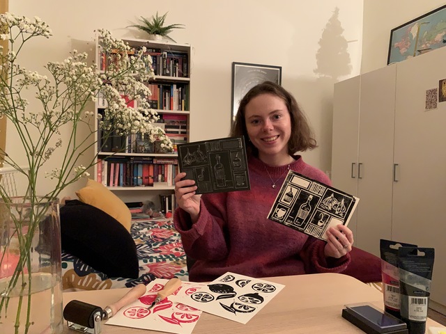 Hylke posing with some linoleum cuttings and prints.