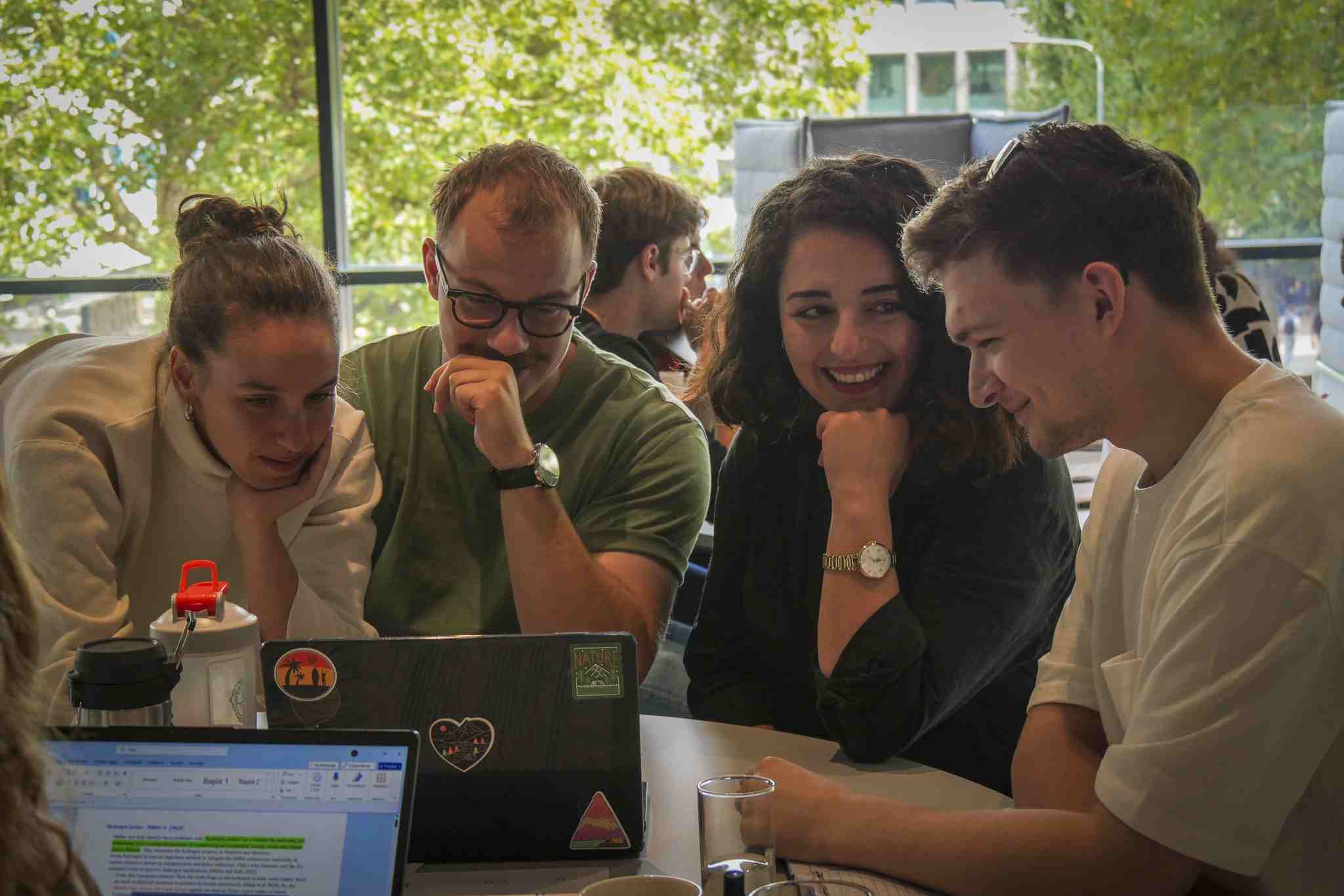 Participants of the 2025 edition of the summer school laughing together