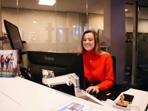 annebeth behind the service desk