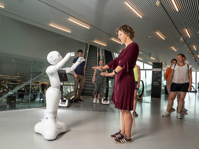 Jenny van Doorn and a social robot