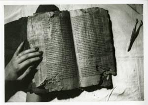 Codex II, opened at page 50-51 (the conclusion and subscript title of the "Gospel of Thomas"). The hand is that of Marianne Doresse. Photo was taken by Jean Doresse in the home of Maria Dattari.