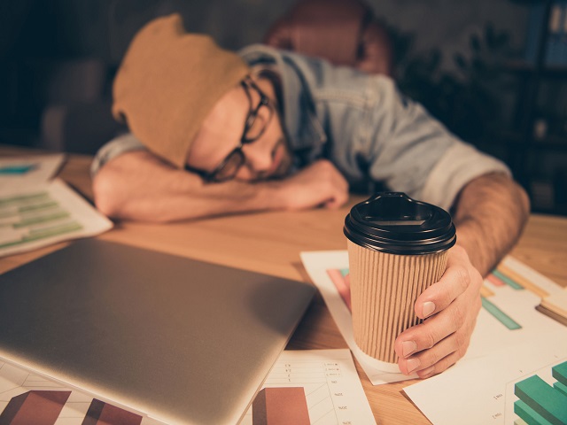 Does coffee help people to get through a tough day at the office?