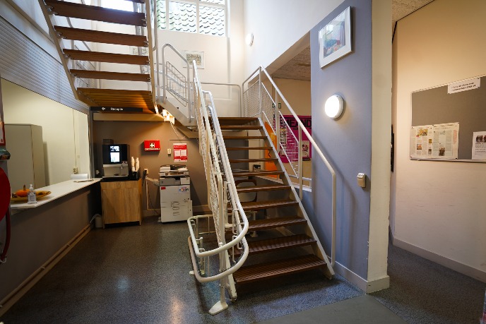 Stairs with built-in chair elevator in the building