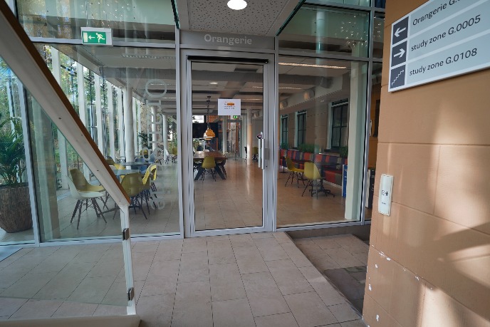 Entrance to the orangerie, push button on the right wall