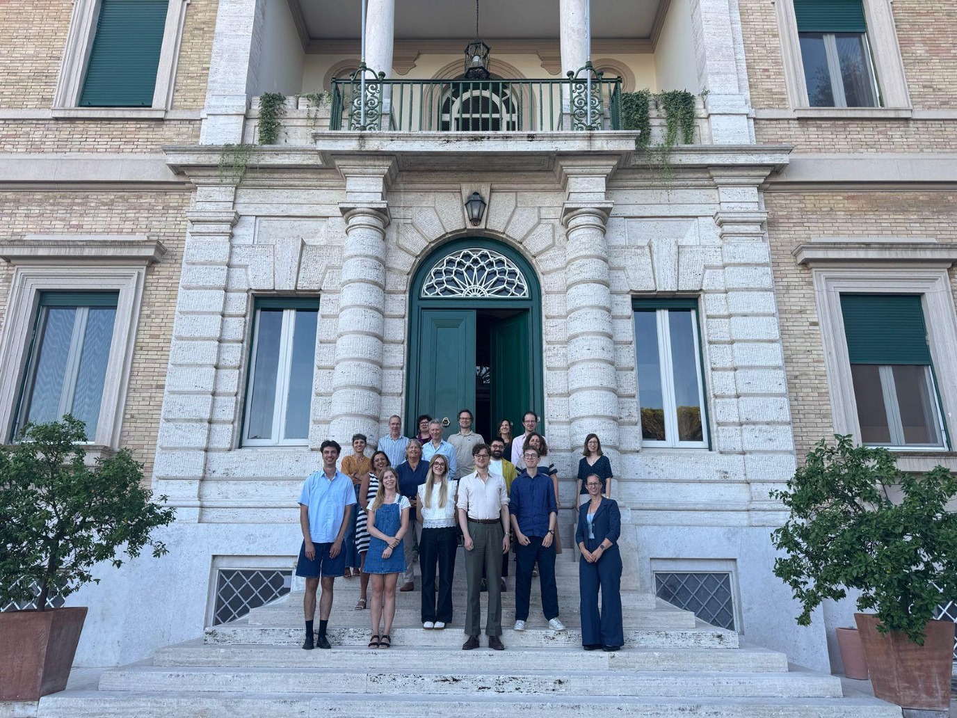 Scholars in front of the KNIR building