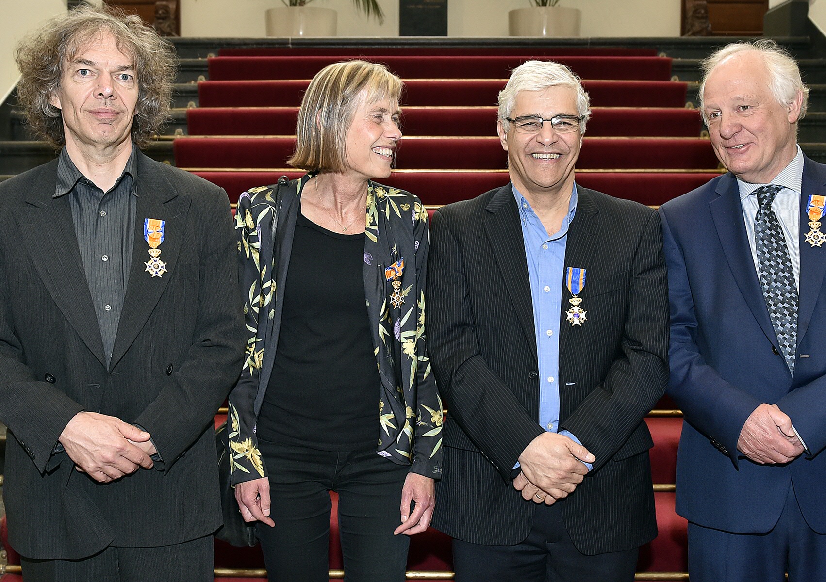 De vier gedecoreerde hoogleraren in het Academiegebouw