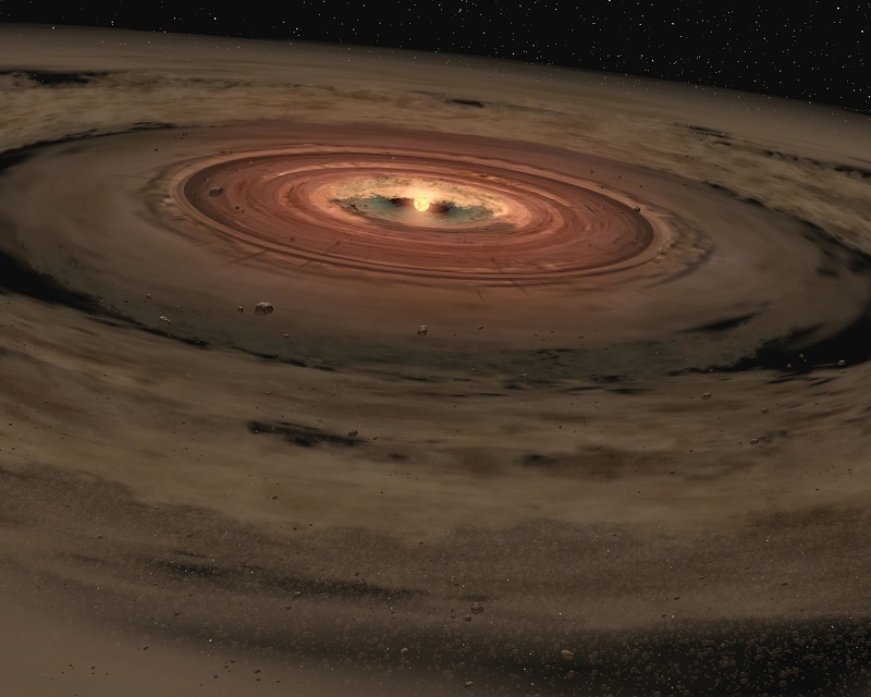 Artistieke weergave van een heel jonge ster met daaromheen een schijf van gas en stof. Wetenschappers vermoeden dat uit deze materialen rotsachtige planeten zoals de aarde worden gevormd. ©NASA/JPL-Caltech