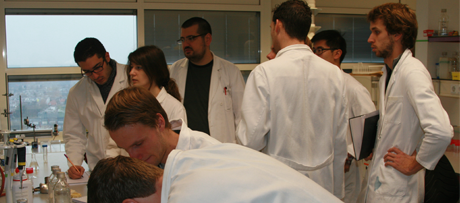 Picture of students performing an experiment