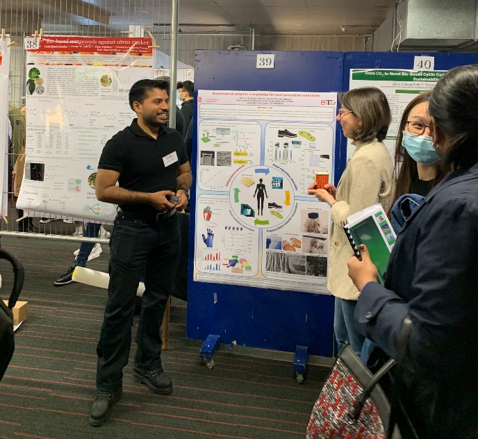 Debarun Sengupta is talking about his poster to the interested public at the ENTEG day