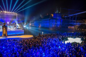 An image from the finale of last Thursday’s performance of The Passion in The Hague. Here you can see Jesus standing on the water after his resurrection, the giant cross that made its way through the city from the Peace Palace, and the Binnenhof in the background. Courtesy of The Passion Facebook page