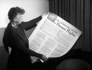 Eleanor Roosevelt, the first chairperson of the UN Human Rights Commission and a driving force behind the drafting of the Universal Declaration of Human Rights, holds the finished document. Courtesy of Wikimedia.