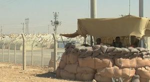 Syrian Refugee Centre on the Turkish Border, protected by soldiers. Source: Wikimedia Commons, Public Domain