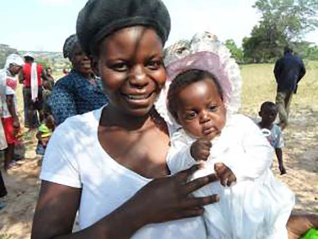 A mother and her baby at one of the health clinics in Lupane ADP, Zimbabwe. Photo: Brenda Bartelink