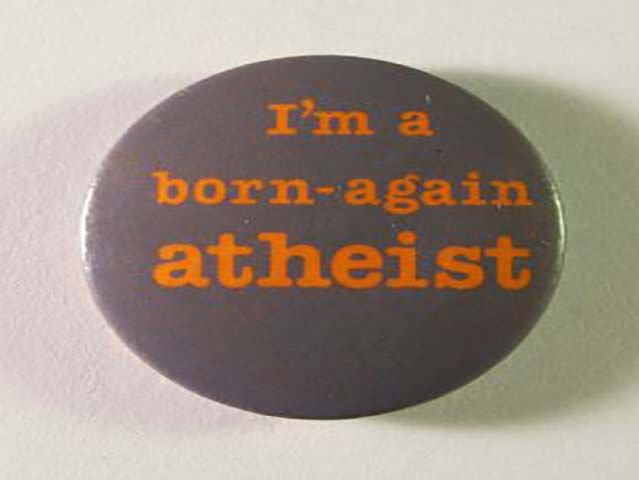 &ldquo;Born-again atheist badge, c.1987&rdquo; by Unknown &ndash; Personal collection. Licensed under Public Domain via Wikimedia Commons