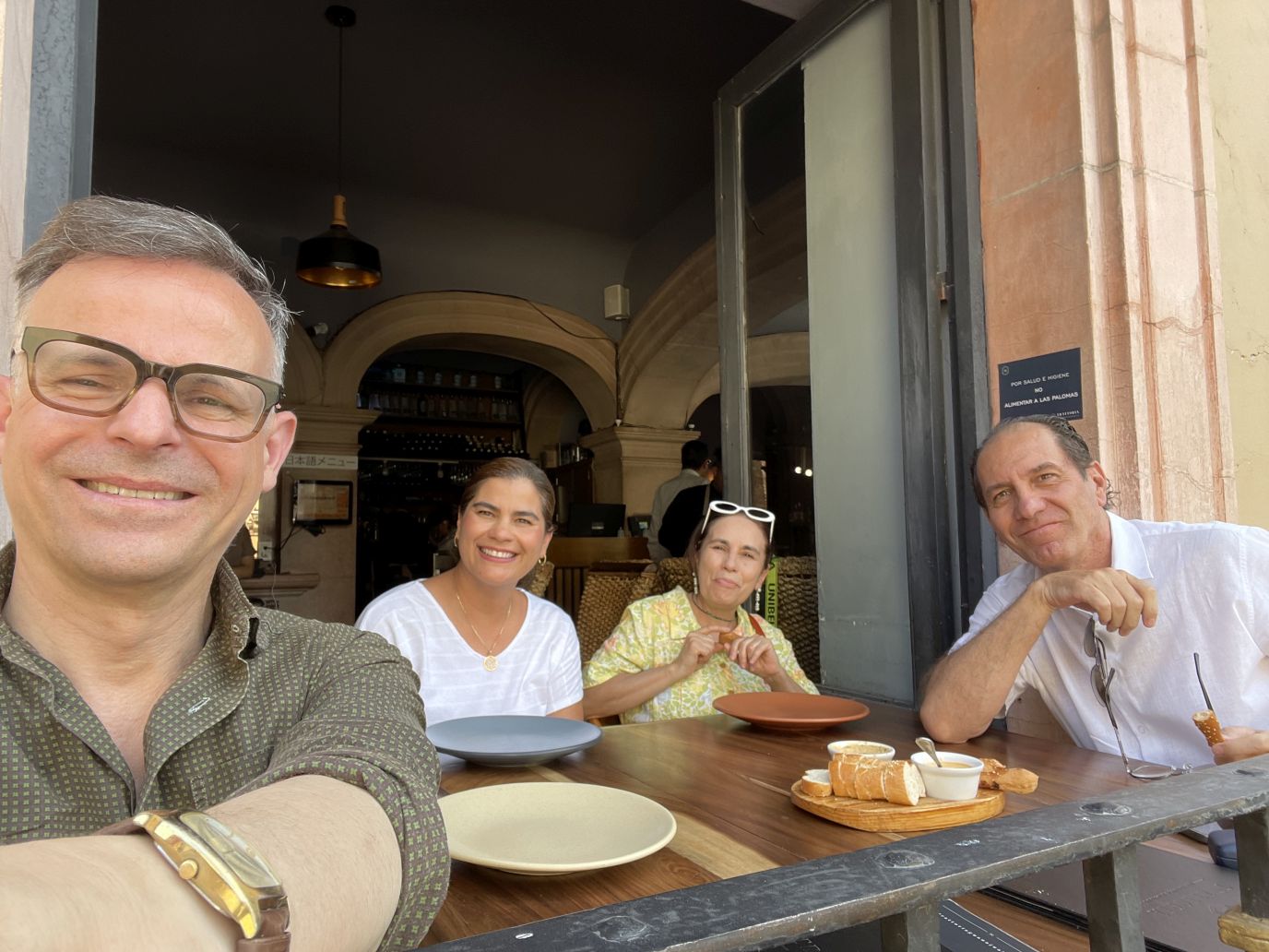 People sitting outside at a cafe during the visit