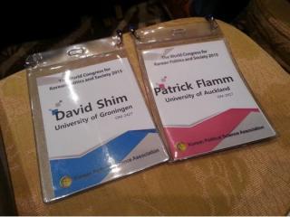 Two different colored name tags