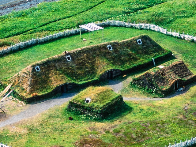 Fig 1. Reconstructed Norse buildings near L'Anse aux Meadows National Historical SIte (Russ Heinl aerial photography)