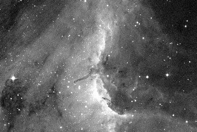 This is an H-alpha image of the Pelican Nebula in the Swan constellation. The CCD is illuminated 2x30 minutes through the H-alpha filter. The shot reveals structures of swirling gas and dust. In the top right corner you can find a track of a satellite that traversed the image field during recording.