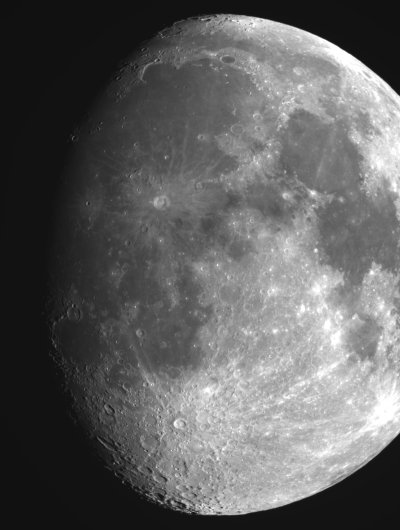 An image of the moon. Using a telescope or binoculars, structures sush as craters on the moon that cannot be seen with the naked eye become visible.