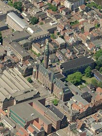 University buildings in the city centre: in the middle the Academy building, across the street the university library and on the upper left the Harmonie building